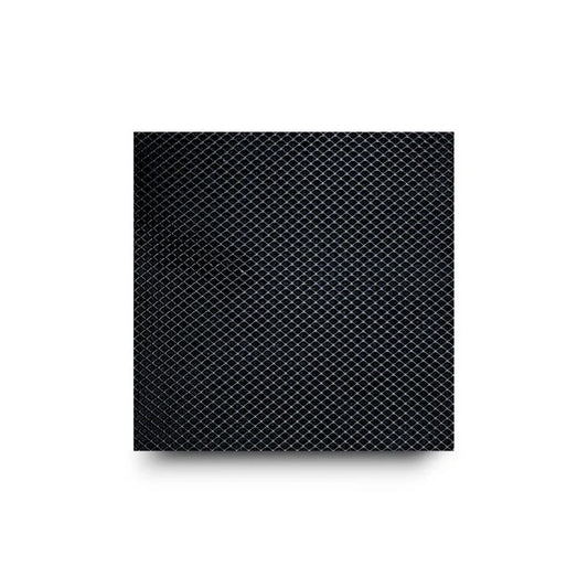 Close-up of a black diamond-patterned surface with a drop shadow.