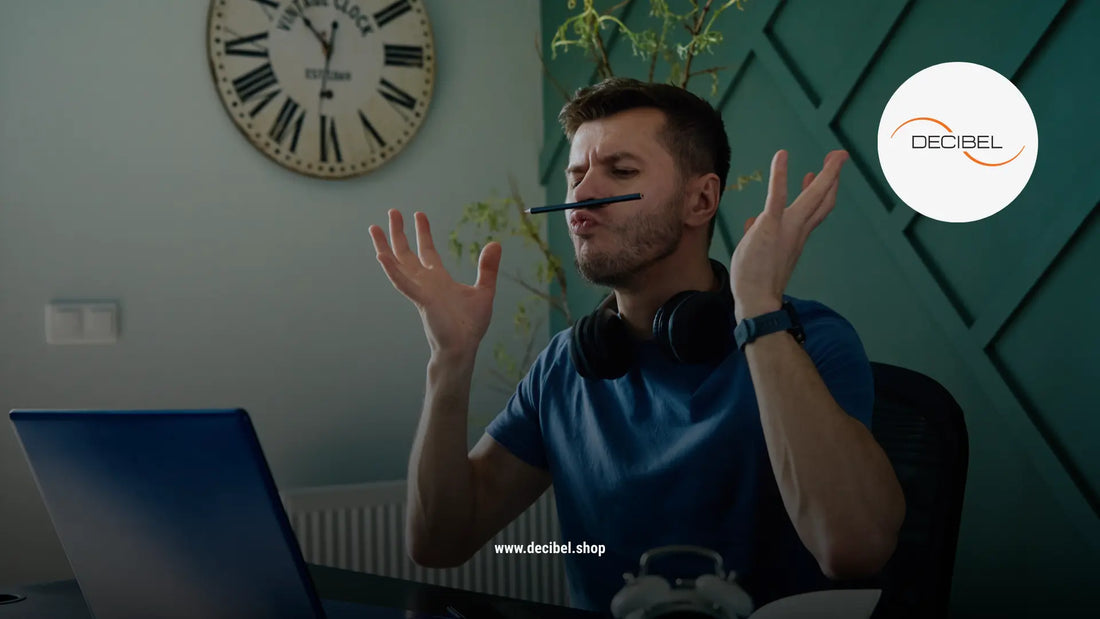 man having fun at the office balancing a pencil on his nose