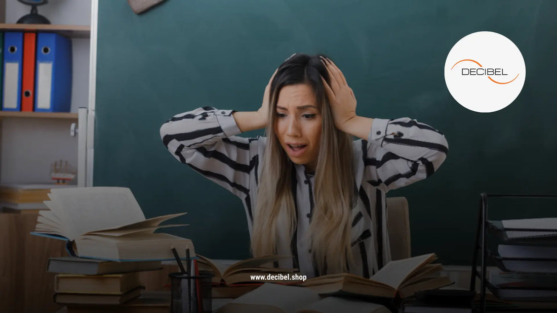 terrified woman in an office holding her head with hands