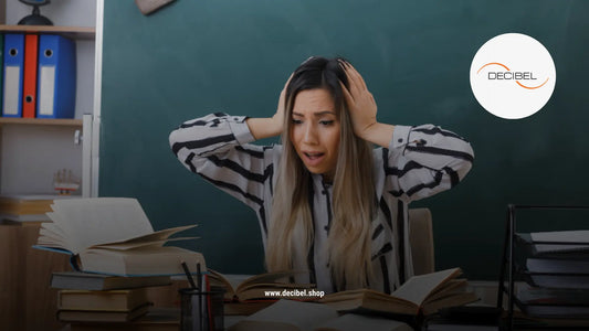 terrified woman in an office holding her head with hands