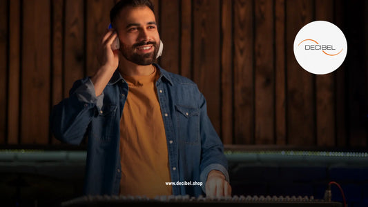 man in jeans shirts listening to music with headphones