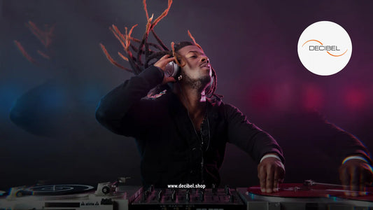 dj in a club playing and grooving on his music