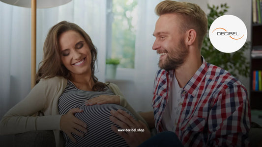 man and a pregnant woman smiling