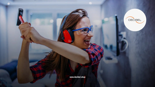 angry woman hitting a wall with a hammer